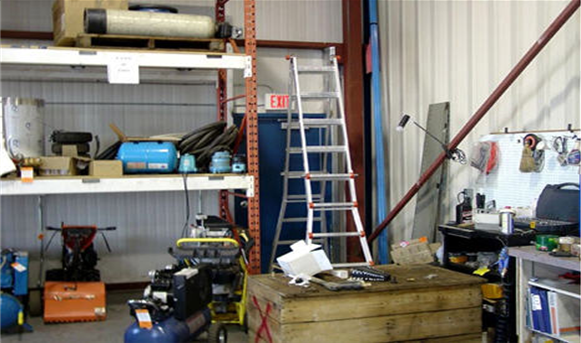 Highway garage with supplies, ladder, shelfing