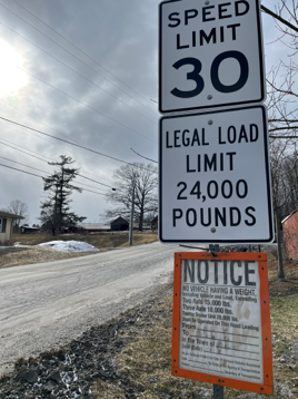 speed limit sign with weight limit load posted